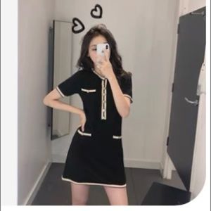 Black and cream knit body-con dress with pockets. Gold button details.